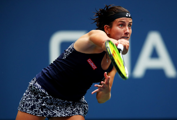 Anastasija Sevastova hits a serve during her fourth-round match against Maria Sharapova at the 2017 U.S. Open. | Photo: Clive Brunskill/Getty Images