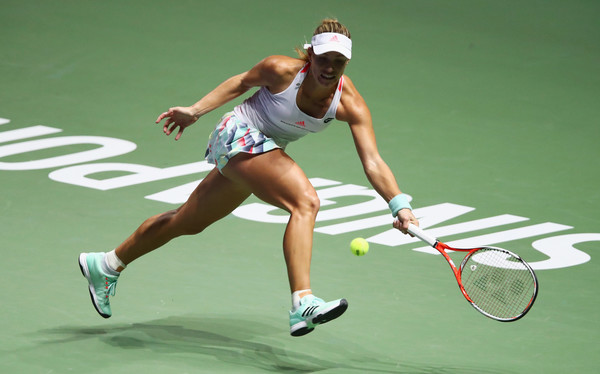 Angelique Kerber chases down a ball during her semifinal match against Agnieszka Radwanska at the 2016 BNP Paribas WTA Finals Singapore presented by SC Global. | Photo: Clive Brunskill/Getty Images