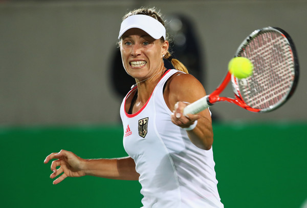 Angelique Kerber hits a forehand during her women’s singles gold medal match against Monica Puig on Day 8 of the Rio 2016 Olympic Games. | Photo: Clive Brunskill/Getty Images South America