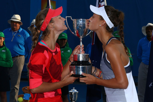 Anna Kalinskaya (left) and Tereza Mihalikova kiss the trophy after winning the Junior Girls' Doubles Final during the 2016 Australian Open Tennis Championships. | Photo: Jack Thomas/Getty Images AsiaPac