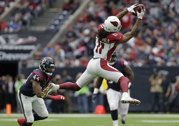 Larry Fitzgerald #11 of the Arizona Cardinals catches a pass in the second quarter defended by Jelani Jenkins #44 of the Houston Texans. |Source: Tim Warner/Getty Images North America|