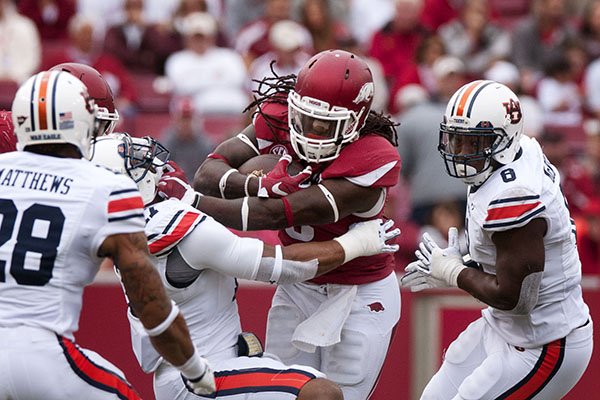 Jared Collins runs the ball against Auburn at Donald W. Reynolds Razorback Stadium in Fayetteville/Getty Images