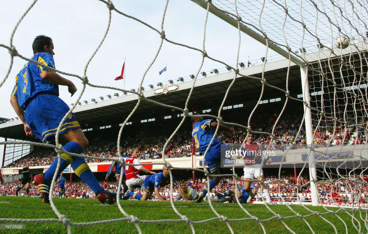 LONDON - MAY 4: Dennis Bergkamp of Arsenal scores their second goal during the FA Barclaycard Premiership match between Arsenal and Leeds United at Highbury on May 4, 2003 in London. (Photo By Ben Radford/Getty Images)