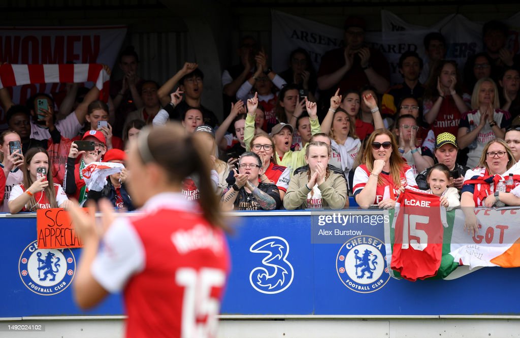 KINGSTON UPON THAMES, ENGLAND - MAY 21: Arsenal fans show their support for Katie McCabe of Arsenal (obscured) following the FA Women's Super League match between Chelsea and Arsenal at Kingsmeadow on May 21, 2023 in Kingston upon Thames, England. (Photo by Alex Burstow/Arsenal FC via Getty Images)