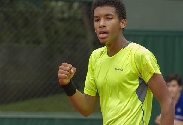 Auger-Aliassime pumps his first during an early round match in Paris. Photo: Susan Mullane/ITF