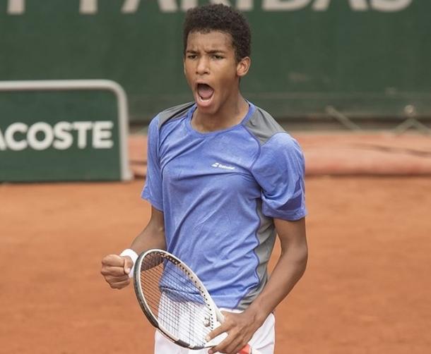 Auger-Aliassime roars during the final. Photo: Susan Mullane/ITF