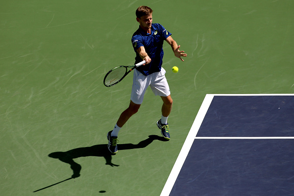 David Goffinreturns a shot to Milos Roanic during the semifinals of the BNP Paribas Open (Photo:Matthew Stockman/Getty Images) 