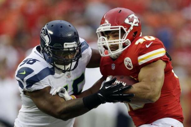 Seattle Seahawks defensive lineman Cliff Avril makes a tackle in a game against the Kansas City Chiefs. Image via Charlie Riedel/AP