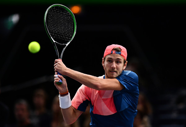 Pouille hits a backhand to Lopez (Photo by Dan Mullan/Getty Images)
