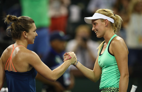 Both players meet at the net after the match | Photo: Clive Brunskill/Getty Images North America