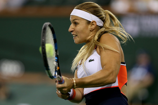 Dominika Cibulkova hits a backhand | Photo: Matthew Stockman/Getty Images North America