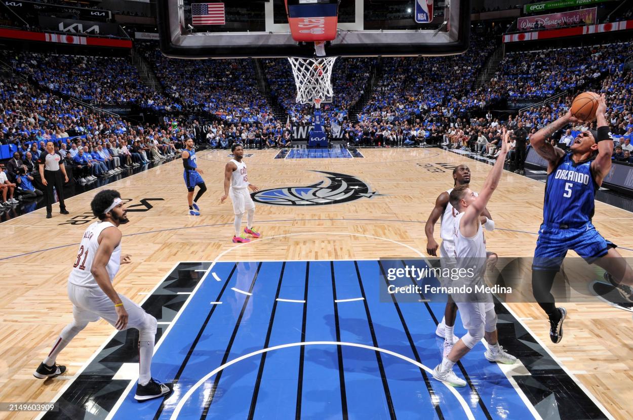 ORLANDO, FL - APRIL 25: <strong><a  data-cke-saved-href='https://www.vavel.com/en-us/nba/2024/02/19/1173103-following-a-lacklustre-all-star-game-the-nba-once-more-left-looking-for-answers.html' href='https://www.vavel.com/en-us/nba/2024/02/19/1173103-following-a-lacklustre-all-star-game-the-nba-once-more-left-looking-for-answers.html'>Paolo Banchero</a></strong> #5 of the Orlando Magic shoots the ball during the game against the Cleveland Cavaliers during Round 1 Game 3 of the 2024 NBA Playoffs on April 25, 2024 at Kia Center in Orlando, Florida. NOTE TO USER: User expressly acknowledges and agrees that, by downloading and or using this photograph, User is consenting to the terms and conditions of the Getty Images License Agreement. Mandatory Copyright Notice: Copyright 2023 NBAE (Photo by Fernando Medina/NBAE via Getty Images)