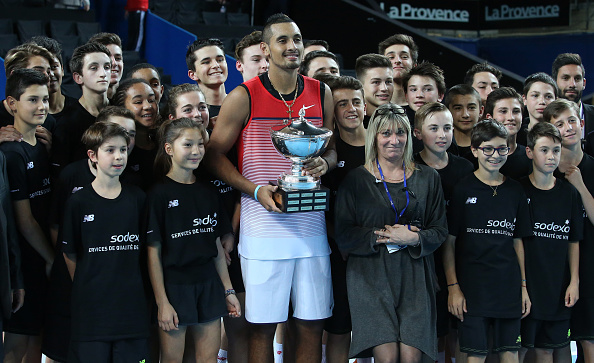 Nick Kyrgios of Australia hold the Open 13 trophy after defeating Marin Cilic in Palais des Sports in Marseille, France. 