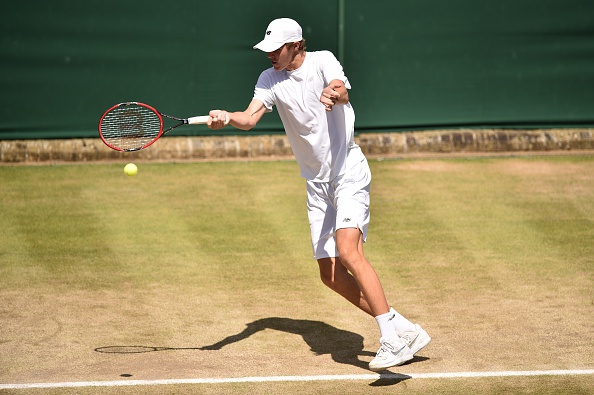 Reilly Opelka returning a shot to Taylor Fritz during their Junior Wimbledon semifinals match (Photo:Leon Neal/Getty Images)