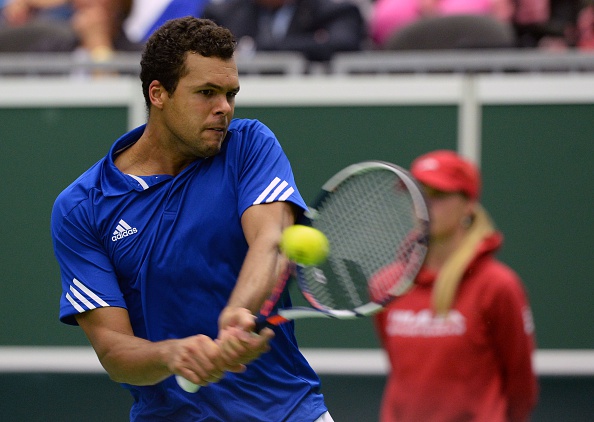 Jo-Wilfried Tsonga of France returns the ball to Lukas Rosol (Michal Cizek/Getty Images) 