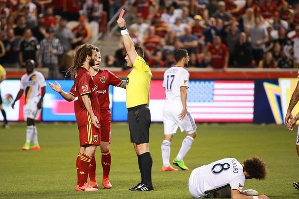 Sorin Stoica shows a red card to Kyle Beckerman during a March 18, 2017 match between Real Salt Lake and the Los Angeles Galaxy. | Photo: Chris Nicoll, USA TODAY Sports