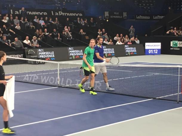 Shapovalov (in green) and Benneteau shake hands after the match. Photo: Open 13 Marseille