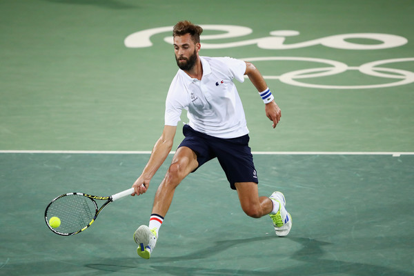Benoit Paire plays a forehand to Fabio Fognini during their second round match at the Olympics/Clive Brunskill/Getty Images