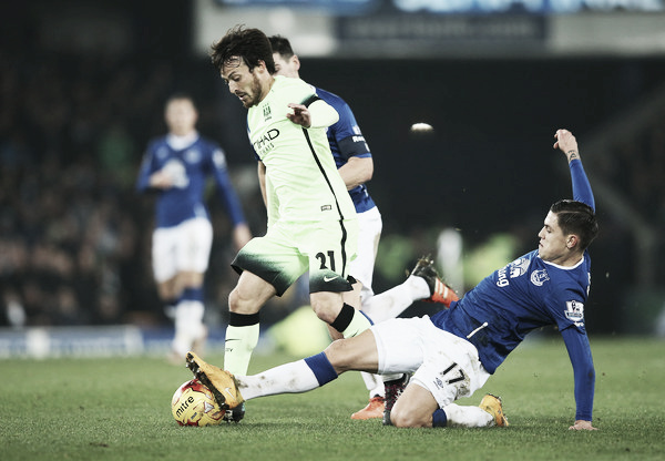 Muhamed Besic tackles David Silva. Photo: Zimbo