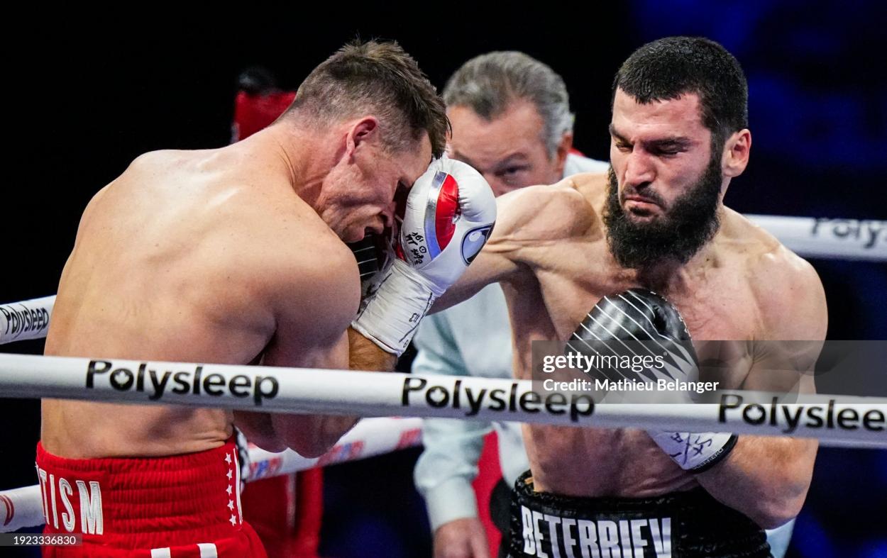 QUEBEC CITY, CANADA - JANUARY 13: Artur Beterbiev of Canada punches Callum Smith of the United Kingdom during their WBC, IBF and WBO light-heavyweight world championship fight at Videotron Centre on January 13, 2024 in Quebec City, Canada. (Photo by Mathieu Belanger/Getty Images)