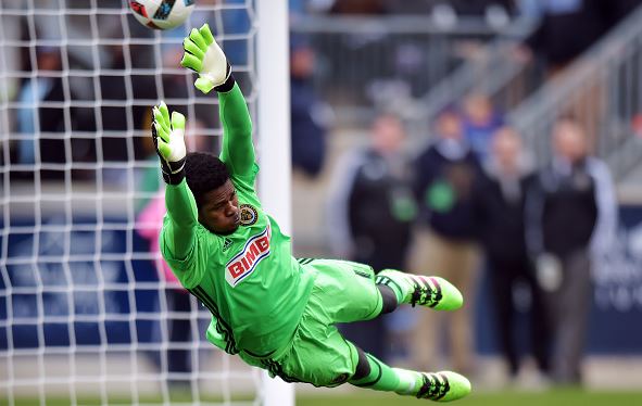 Goalkeeper Andre Blake of Philadelphia Union dives to make a save as the ball get past him and bounces off the post against the New England Revolution at Talen Energy Stadium on March 20, 2016 in Chester, Pennsylvania / Drew Hallowell - Getty Images