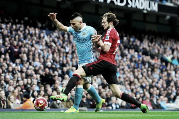 Sergio Aguero and Daley Blind battle for the ball in last season's Derby - Picture: Getty