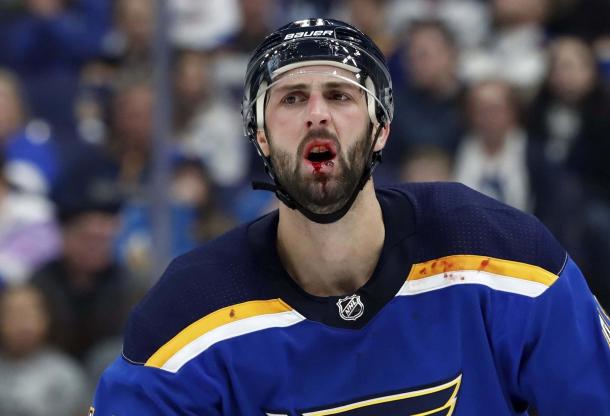 St. Louis Blues' Robert Bortuzzo has a bloody lip after being hit with a stick during the third period of an NHL hockey game against the Winnipeg Jets, Saturday, Dec. 16, 2017, in St. Louis. The Blues won 2-0. (AP Photo/Jeff Roberson)