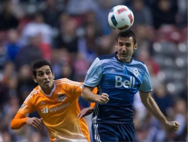 Andrew Jacobson (in right, blue) scored a great goal and helped preserve the Whitecaps' win. Photo credit: Darryl Dick/The Canadian Press 