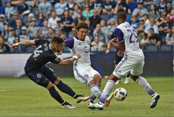 Sporting Kansas City forward Dominic Dwyer (left, in dark blue) has scored four goals in his last four MLS matches. Photo credit: Peter G. Aiken/Getty Images Sport