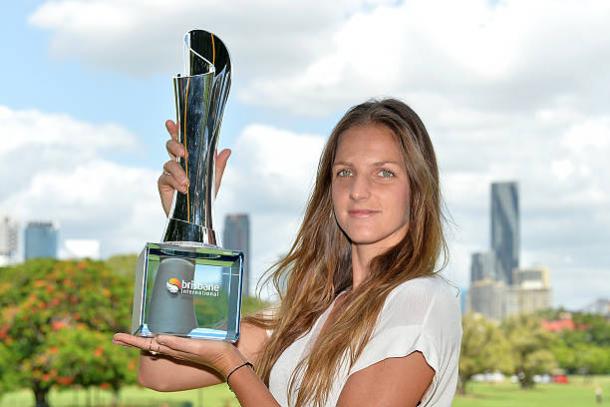 Karolina Pliskova poses with the Brisbane International title after beating Alize Cornet in the final (Getty/Bradley Kanaris)
