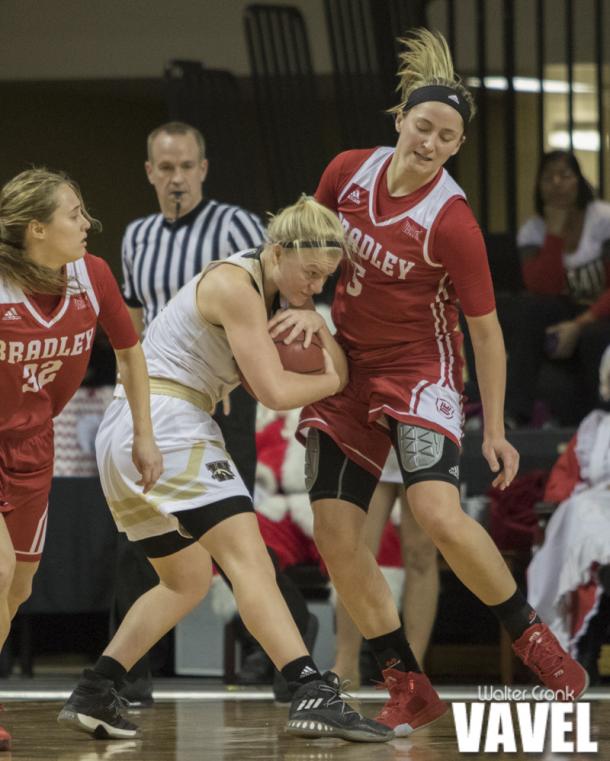 Western Michigan's Meredith Shipman (1) fights for the tough defensive rebound. Photo: Walter Cronk