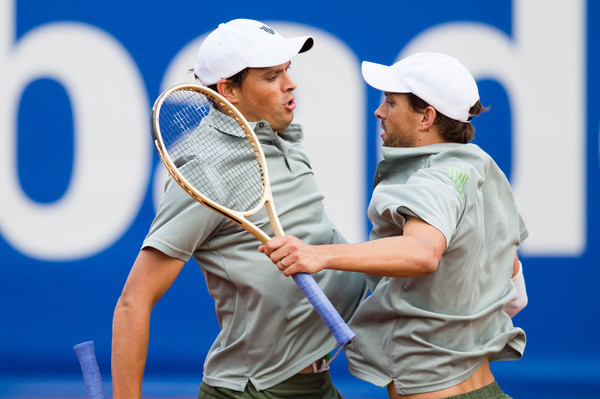 Bob (left) and Mike Bryan do their famous chest bump during a match in Barcelona. Photo: Alex Caparros/Getty Images