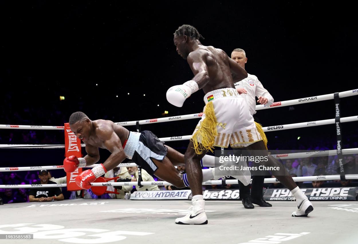 LONDON, ENGLAND - FEBRUARY 03: Joshua Buatsi knocks down Dan Azeez during the British and Commonwealth Light Heavyweight title fight between Dan Azeez and Joshua Buatsi at OVO Arena Wembley on February 03, 2024 in London, England. (Photo by James Chance/Getty Images)
