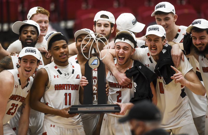 Hartford players pose with the trophy after defeating UMass-Lowell to win the America East title/Photo: Kassi Jackson/Hartford Courant