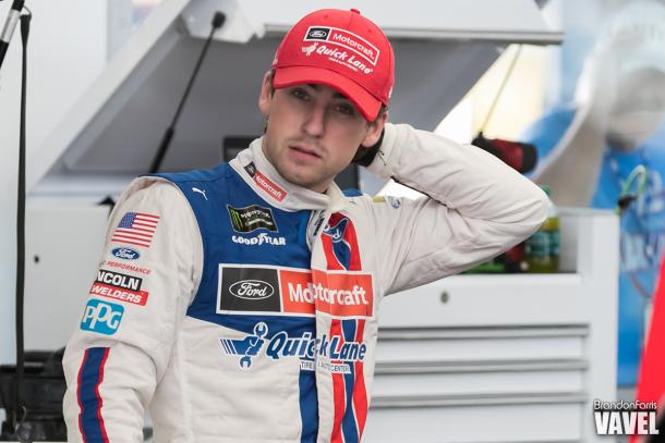 Ryan Blaney looks on in the garage.