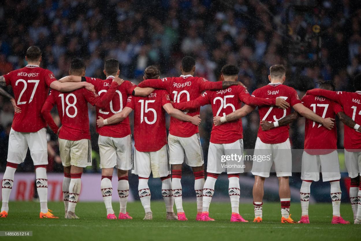 LONDON, ENGLAND - APRIL 23: Manchester United players arm in arm as they watch the penalty shoot out during the Emirates FA Cup Semi Final match between Brighton & Hove Albion and Manchester United at Wembley Stadium on April 23, 2023 in London, England. (Photo by Visionhaus/Getty Images)