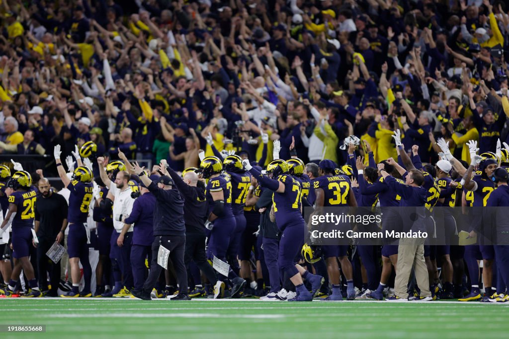 The Michigan Wolverines celebrate after a touchdown in the fourth quarter against the Washington Huskies during the 2024 CFP National Championship game at NRG Stadium on January 08, 2024 in Houston, Texas. (Photo by Carmen Mandato/Getty Images)