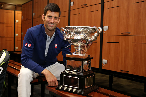 Novak Djokovic with the title last year (Getty/Cameron Spencer)