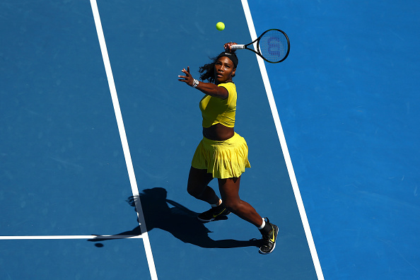 Serena Williams smashes an overhead in her dominating win in the round-of-16. Credit: Cameron Spencer/Getty Images
