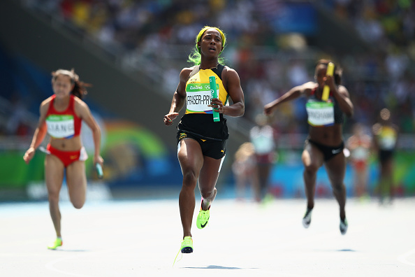 Shelly-Ann Fraser-Pryce leads the Jamaican team to victory in the semifinal of the 4x100m relay (Getty/Cameron Spencer)