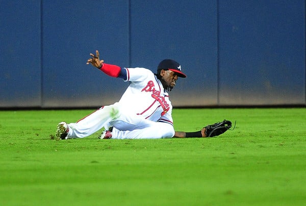 Cameron Maybin #22 of the Atlanta Braves makes a sixth inning sliding catch against the St. Louis Cardinals at Turner Field on October 2, 2015 in Atlanta, Georgia. (Oct. 1, 2015 - Source: Scott Cunningham/Getty Images North America) 