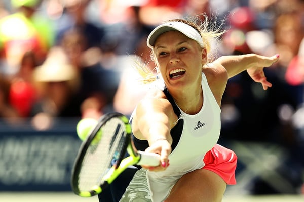 Caroline Wozniacki reaches for a backhand at the US Open in New York City/Getty Images