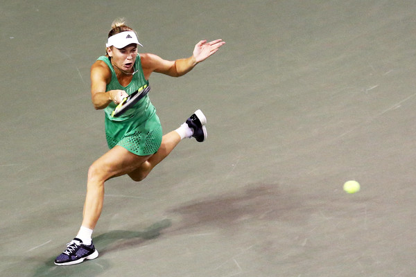 Caroline Wozniacki hits a forehand on the run at the Toray Pan Pacific Open in Tokyo/Getty Images