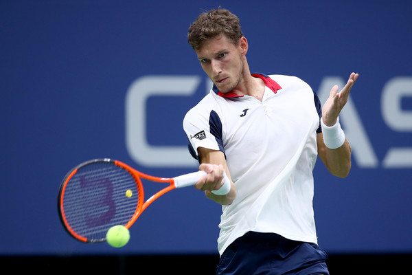 Carreno Busta hits a forehand during his fourth round win. Photo: Clive Brunskill/Getty Images