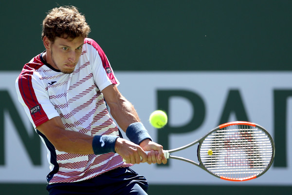 Pablo Carreno Busta hits a backhand during his semifinal loss. Photo: Matthew Stockman/Getty Images