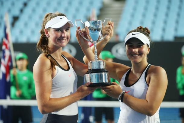 Bianca Vanessa Andreescu (right) and Carson Branstine pose with the Girls’ Doubles winners’ trophy after winning the 2017 Australian Open Junior Championships. | Photo: Pat Scala/Getty Images