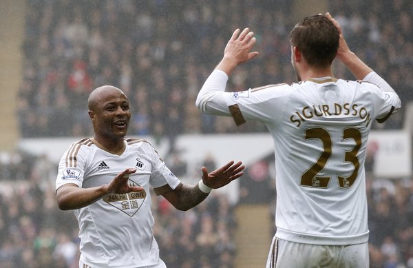 André Ayew celebrates with teammate Gylfi Sigurdsson after breaking the deadlock. (Photo: Swansea City AFC)