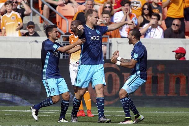 Chad Marshall (center) celebrates his 90'+4' goal against the Houston Dynamo with Tyrone Mears (right) and Cristian Roldan (left) | Source: Troy Taormina - USA TODAY Sports