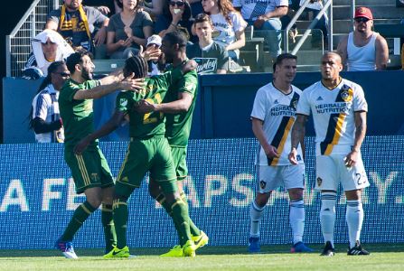 Diego Chara (center, green) celebrates after scoring the lone goal in the Timbers 1-0 victory over the Galaxy | Source: Shaun Clark - Getty Images