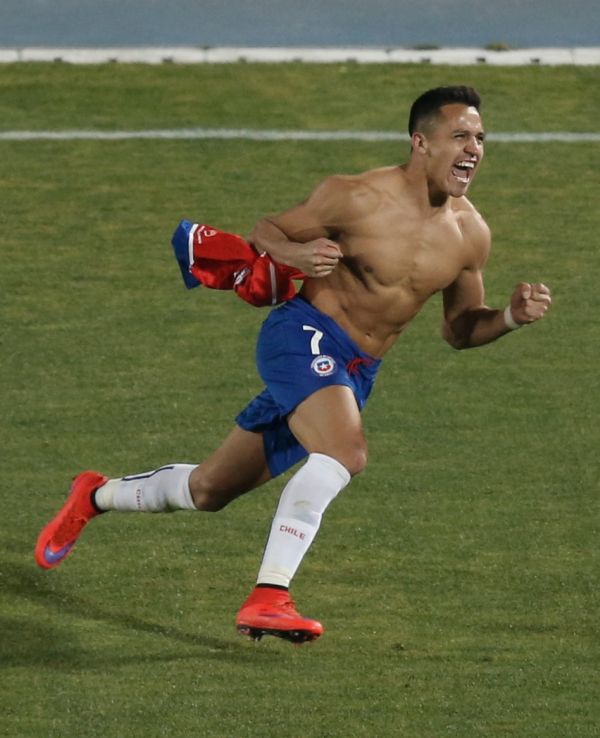 Alexis Sanchez knocked home the winning penalty as Chile took down Argentina last summer to claim their first-ever Copa America victory (Image: Silvia Izquierdo/AP Photo).